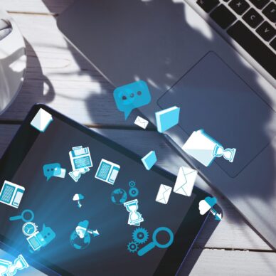 digital composite of smart devices with coffee on table with graphics